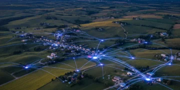 Illustration of rural homes connected by glowing digital lines representing broadband internet access.